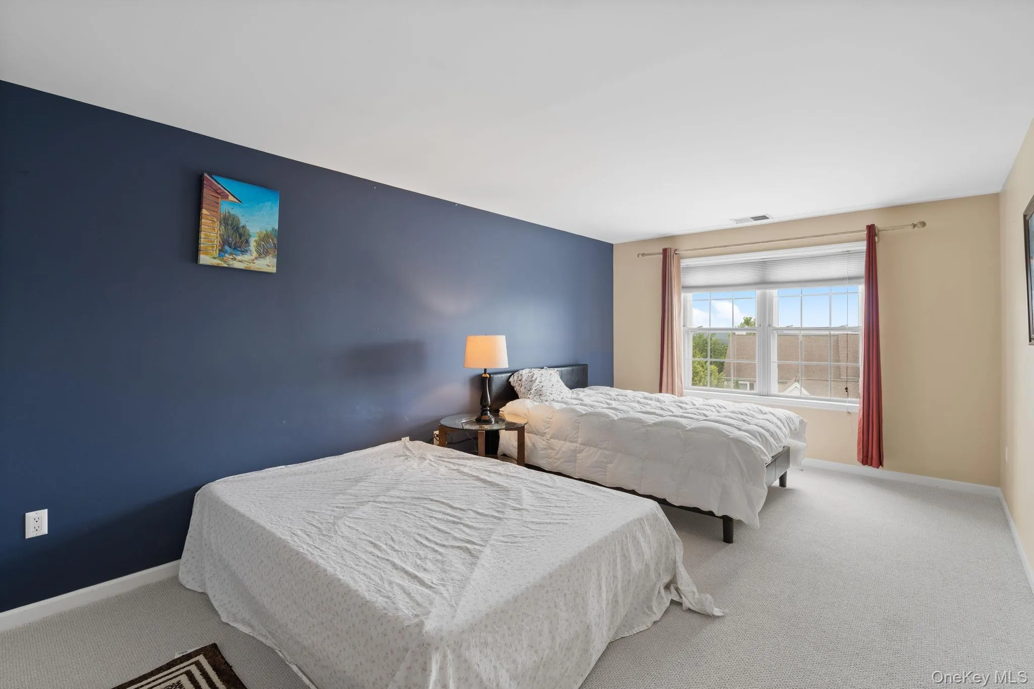 Bedroom featuring carpet floors and baseboards Bedroom featuring carpet floors and baseboards