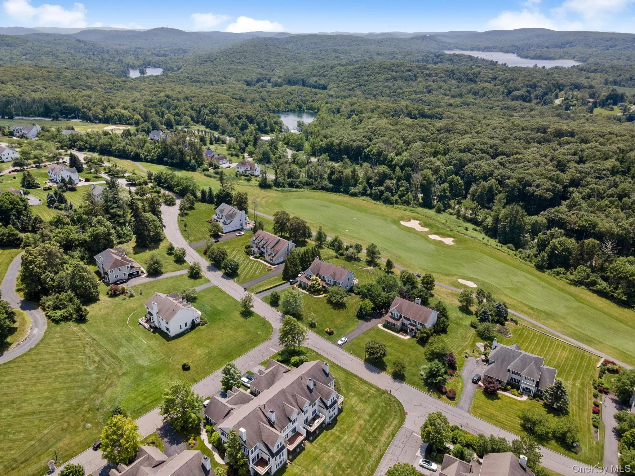 Drone / aerial view of a water and mountain view Drone / aerial view of a water and mountain view