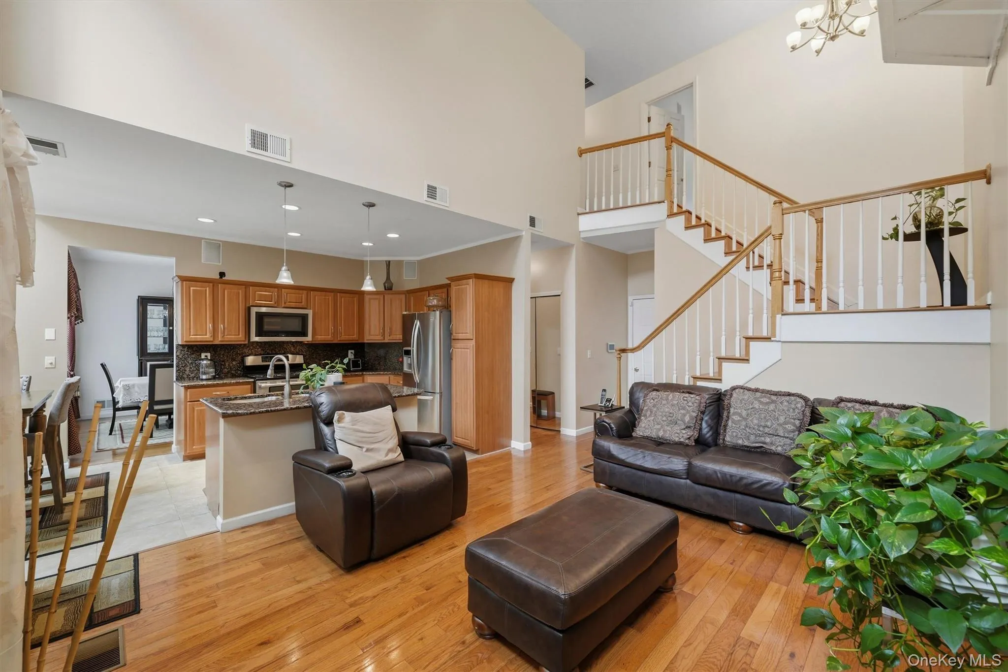 Family room to kitchen. Seating around the island make it the perfect gathering spot. Family room to kitchen. Seating around the island make it the perfect gathering spot.