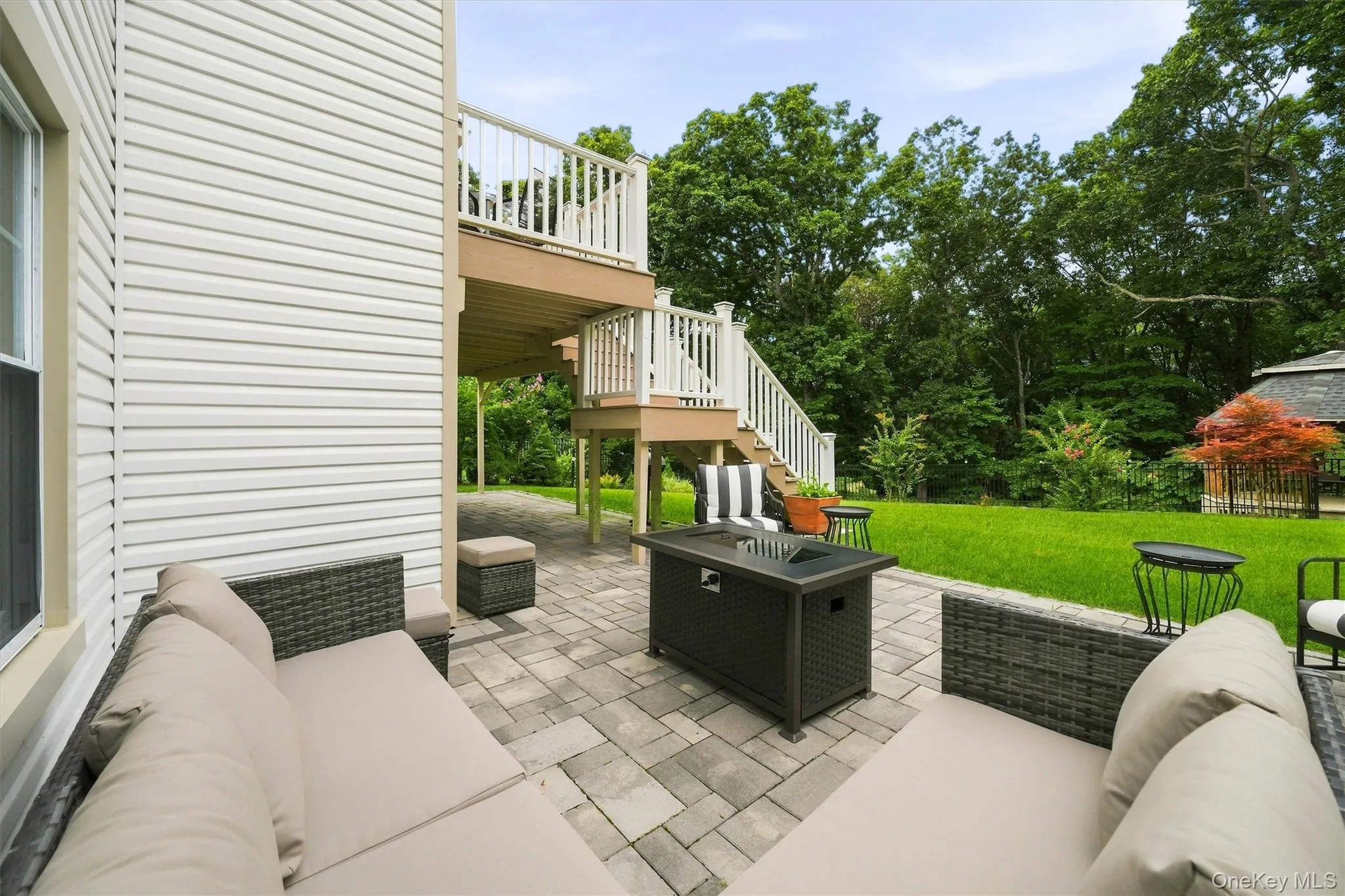 The large patio overlooks the professionally landscaped, private back yard. The large patio overlooks the professionally landscaped, private back yard.