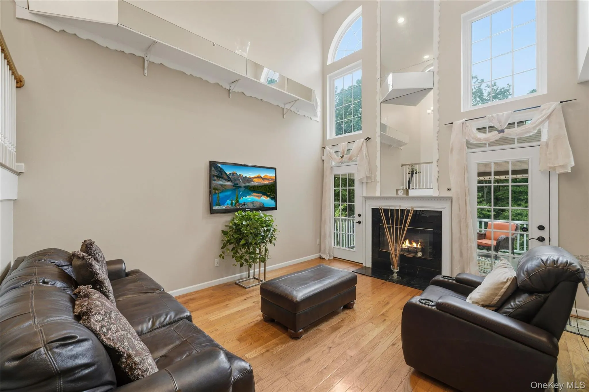 This incredible family room features custom windows and double sliding glass door to deck. This incredible family room features custom windows and double sliding glass door to deck.