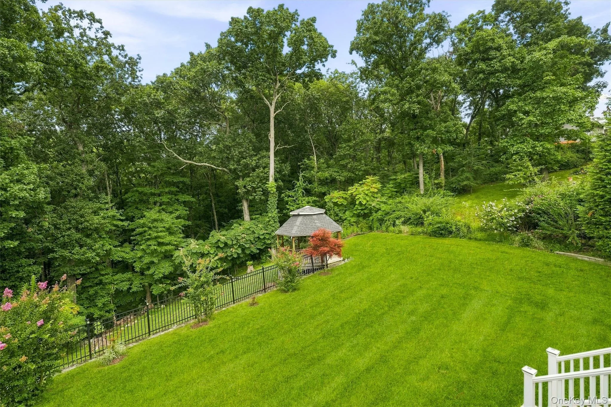 Beautiful, sprawling green lawn back to mature trees for privacy. Beautiful, sprawling green lawn back to mature trees for privacy.