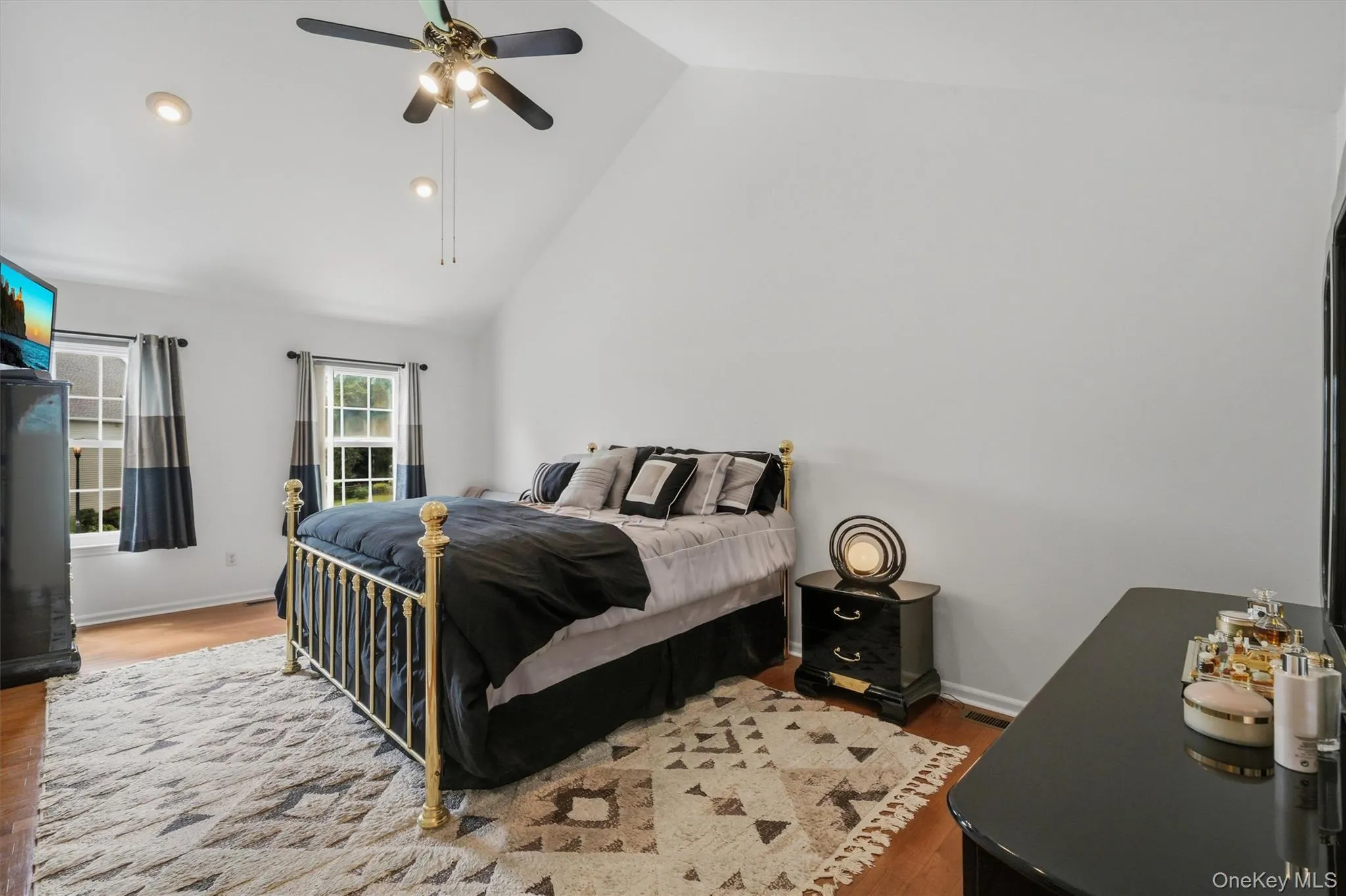 An incredibly large primary bedroom with cathedral ceilings, hardwood flooring and ceiling fan. Large enough for a king size bed with plenty of room. An incredibly large primary bedroom with cathedral ceilings, hardwood flooring and ceiling fan. Large enough for a king size bed with plenty of room.