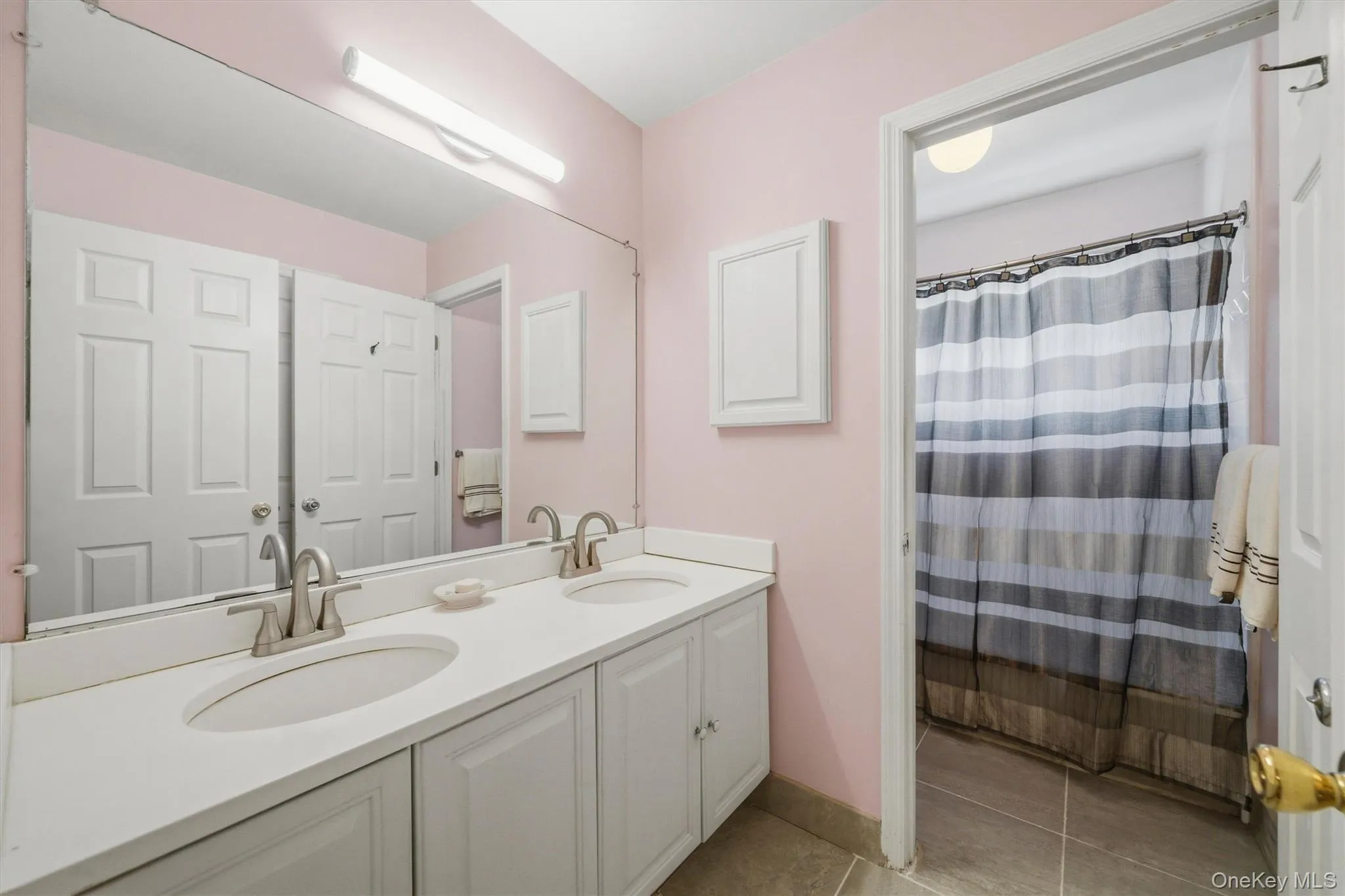 Hall bathroom with separate tub & shower area. Hall bathroom with separate tub & shower area.