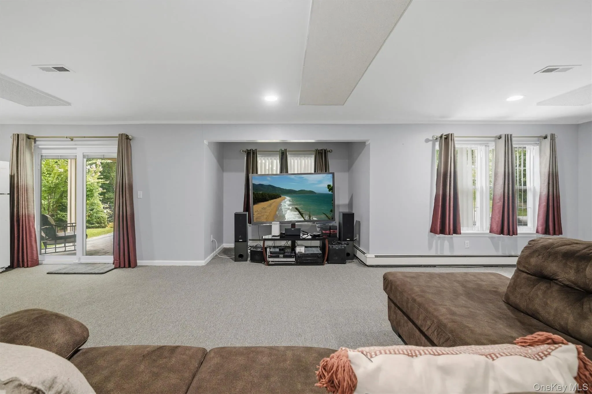 Sliding glass door from recreation room leads to the lower level patio. Sliding glass door from recreation room leads to the lower level patio.