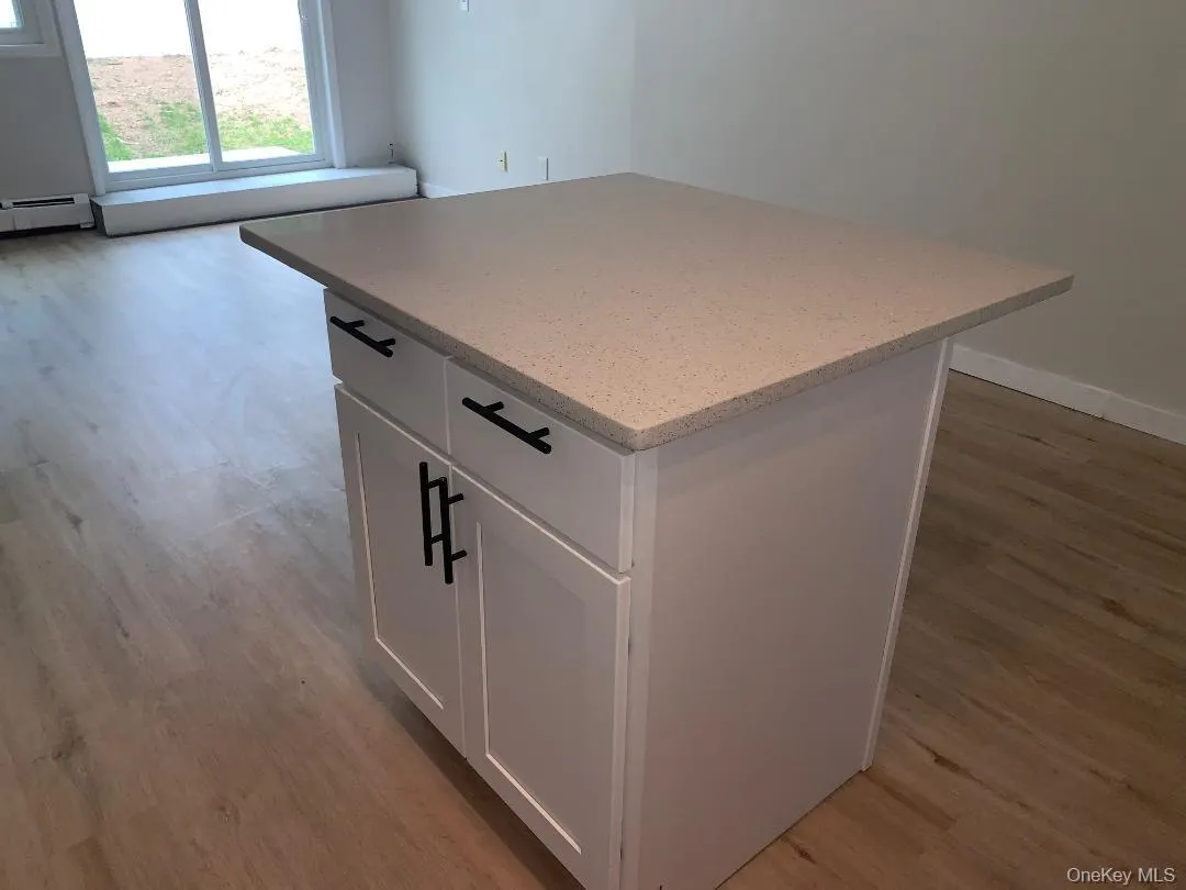 Center island with storage which opens to the living room Center island with storage which opens to the living room