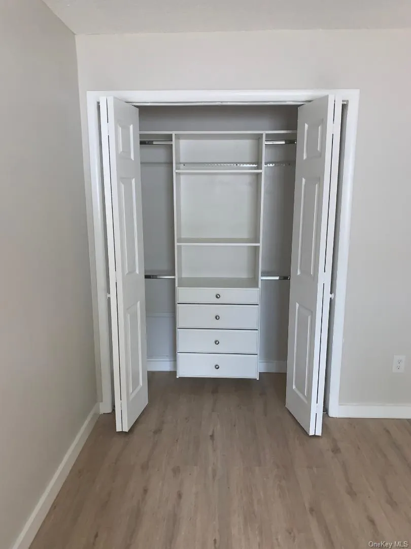 Professionally organized closet within the primary bedroom Professionally organized closet within the primary bedroom
