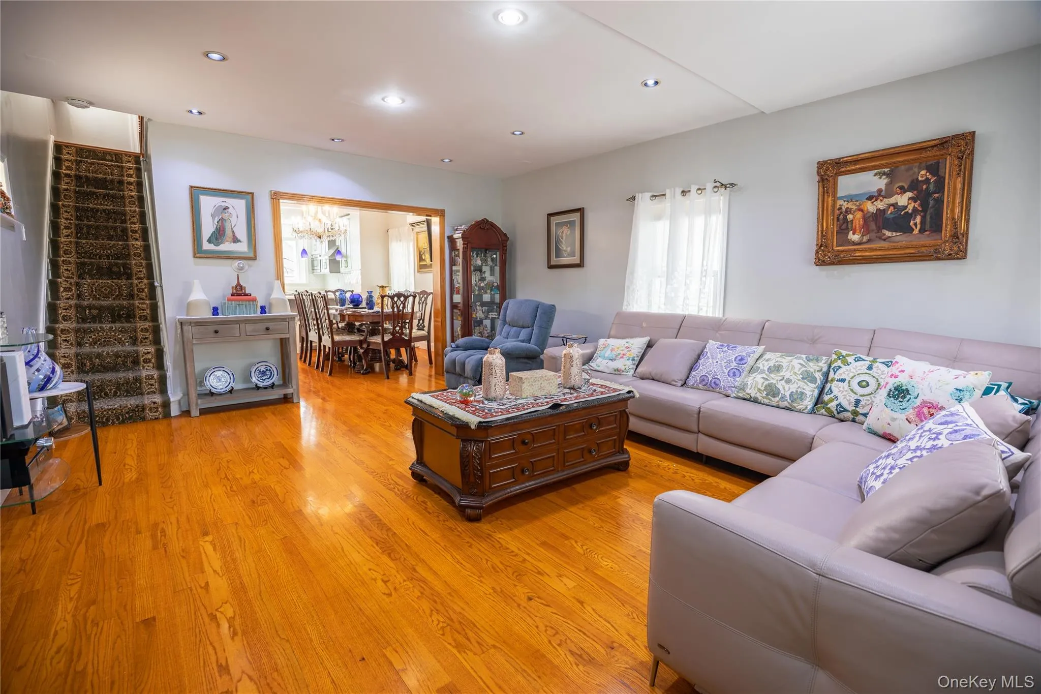 Recessed lighting illuminates wood-finish flooring throughout Recessed lighting illuminates wood-finish flooring throughout