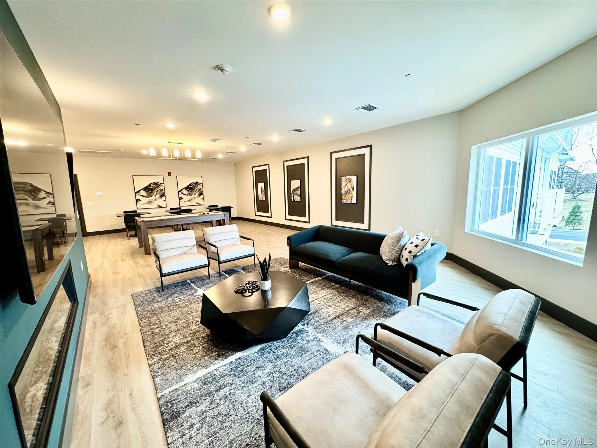 Living room with light hardwood / wood-style floors Living room with light hardwood / wood-style floors