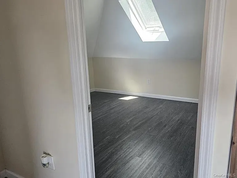 Airy bedroom with luxury vinyl plank flooring features skylight with gorgeous natural light. Airy bedroom with luxury vinyl plank flooring features skylight with gorgeous natural light.