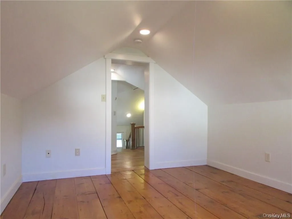 primary bedroom featuring wide plank floors primary bedroom featuring wide plank floors