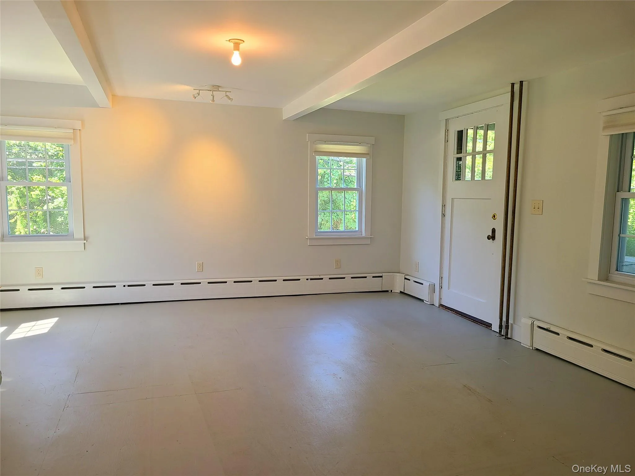 baseboard heat, exposed beams, front door to front porch baseboard heat, exposed beams, front door to front porch