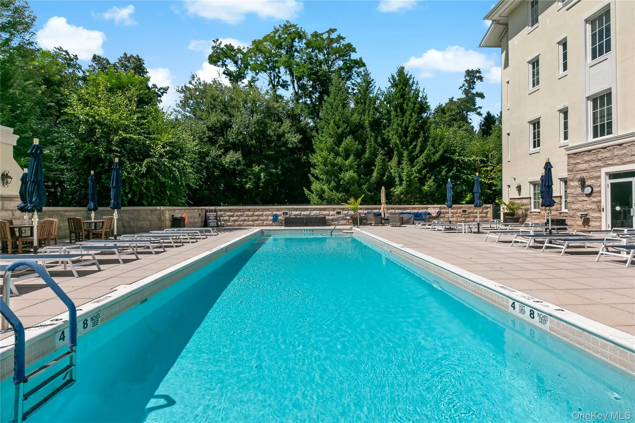 Spend summer days poolside in a beautifully landscaped setting. Spend summer days poolside in a beautifully landscaped setting.