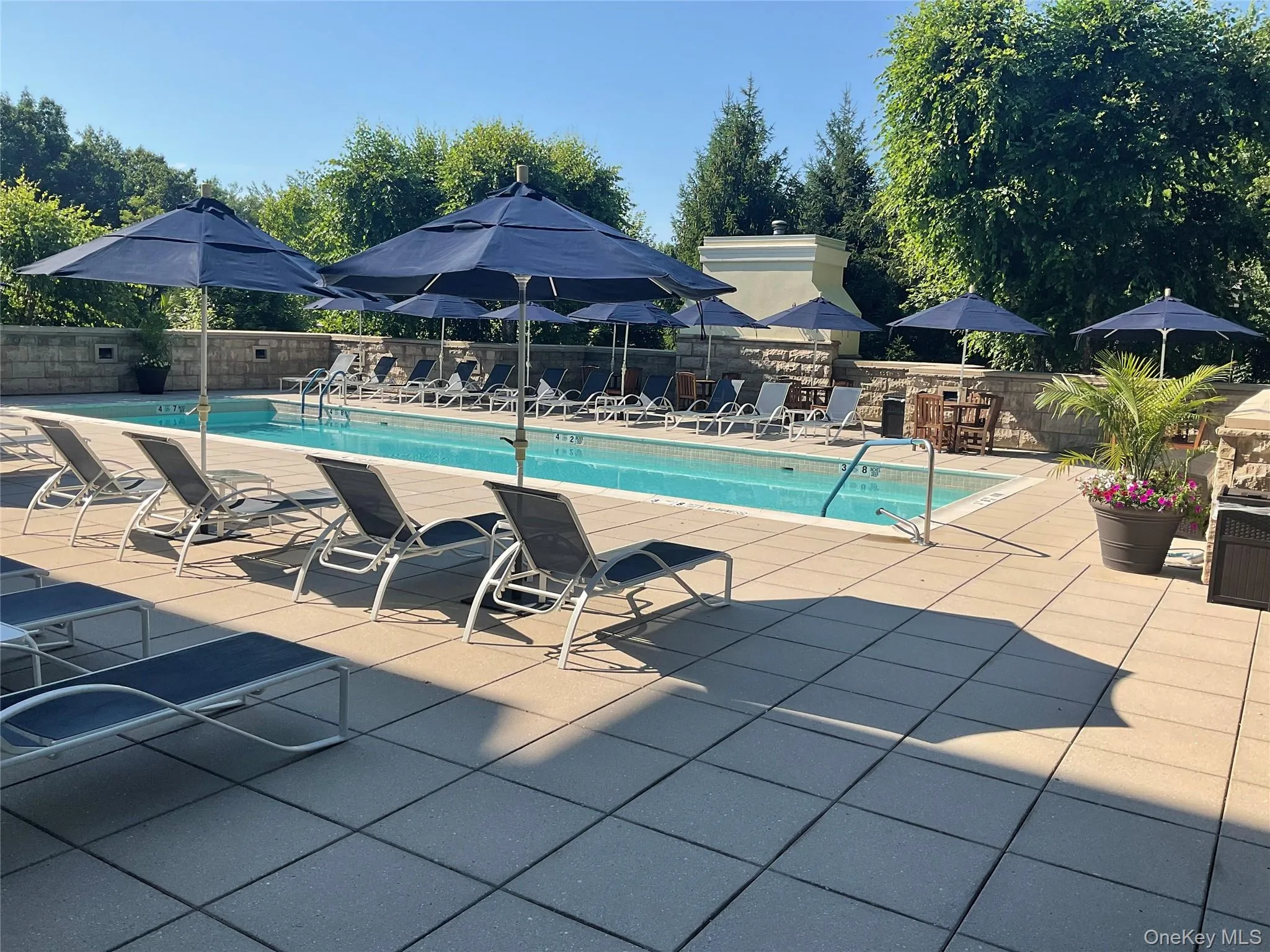 Resort-style living continues outdoors with a secluded pool and spacious sun deck. Resort-style living continues outdoors with a secluded pool and spacious sun deck.