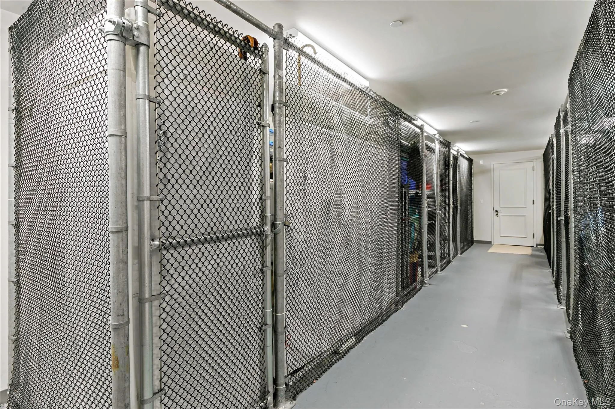 A large private storage room is conveniently located directly across the hall from the residence. A large private storage room is conveniently located directly across the hall from the residence.