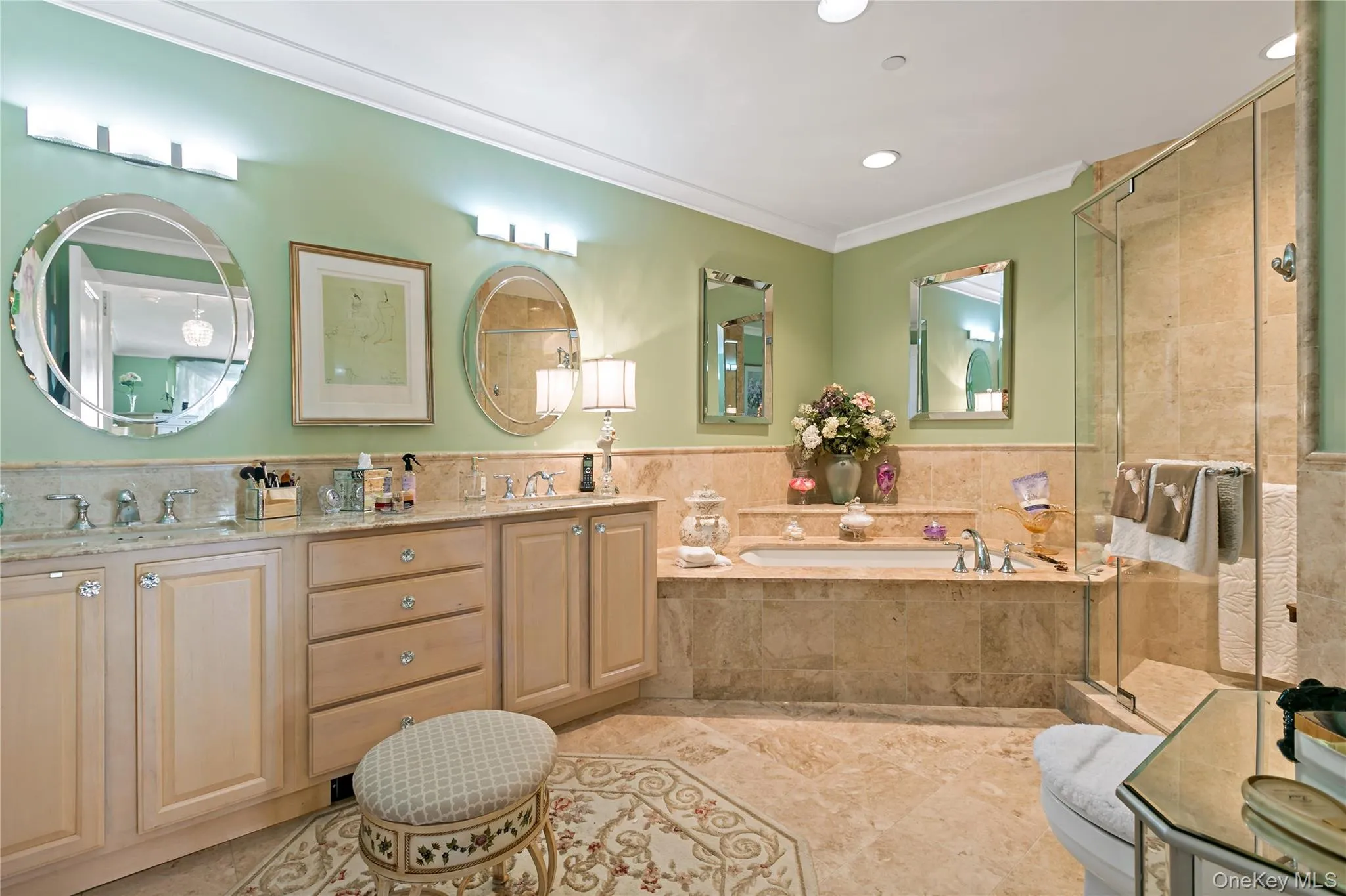 Marble finishes, a soaking tub and separate shower create a luxurious ensuite bath. Marble finishes, a soaking tub and separate shower create a luxurious ensuite bath.