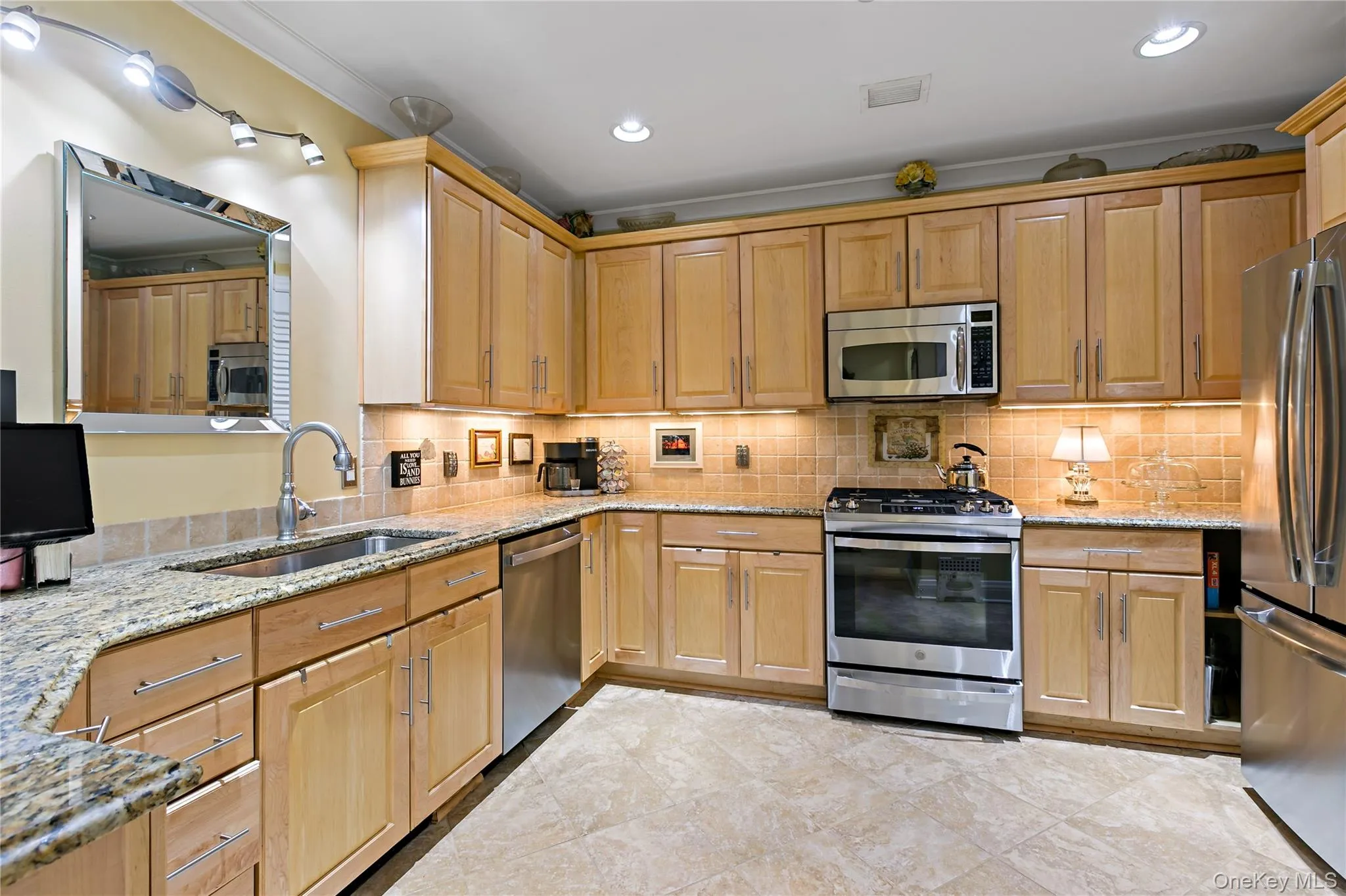 Granite countertops, generous cabinetry and a breakfast bar make the kitchen as functional as it is inviting. Granite countertops, generous cabinetry and a breakfast bar make the kitchen as functional as it is inviting.