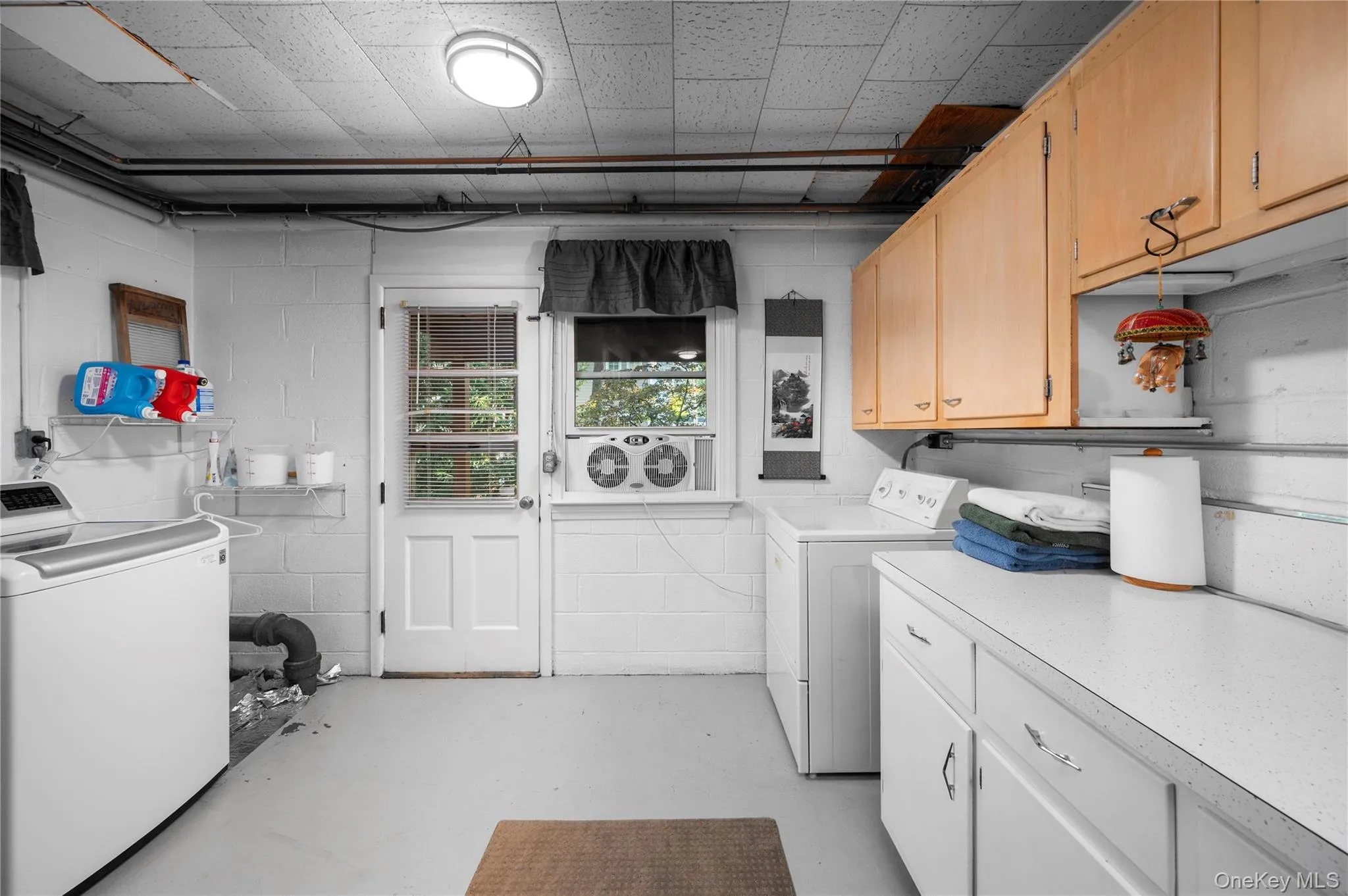 Laundry room with access to back yard. Bathroom is adjacent. Laundry room with access to back yard. Bathroom is adjacent.