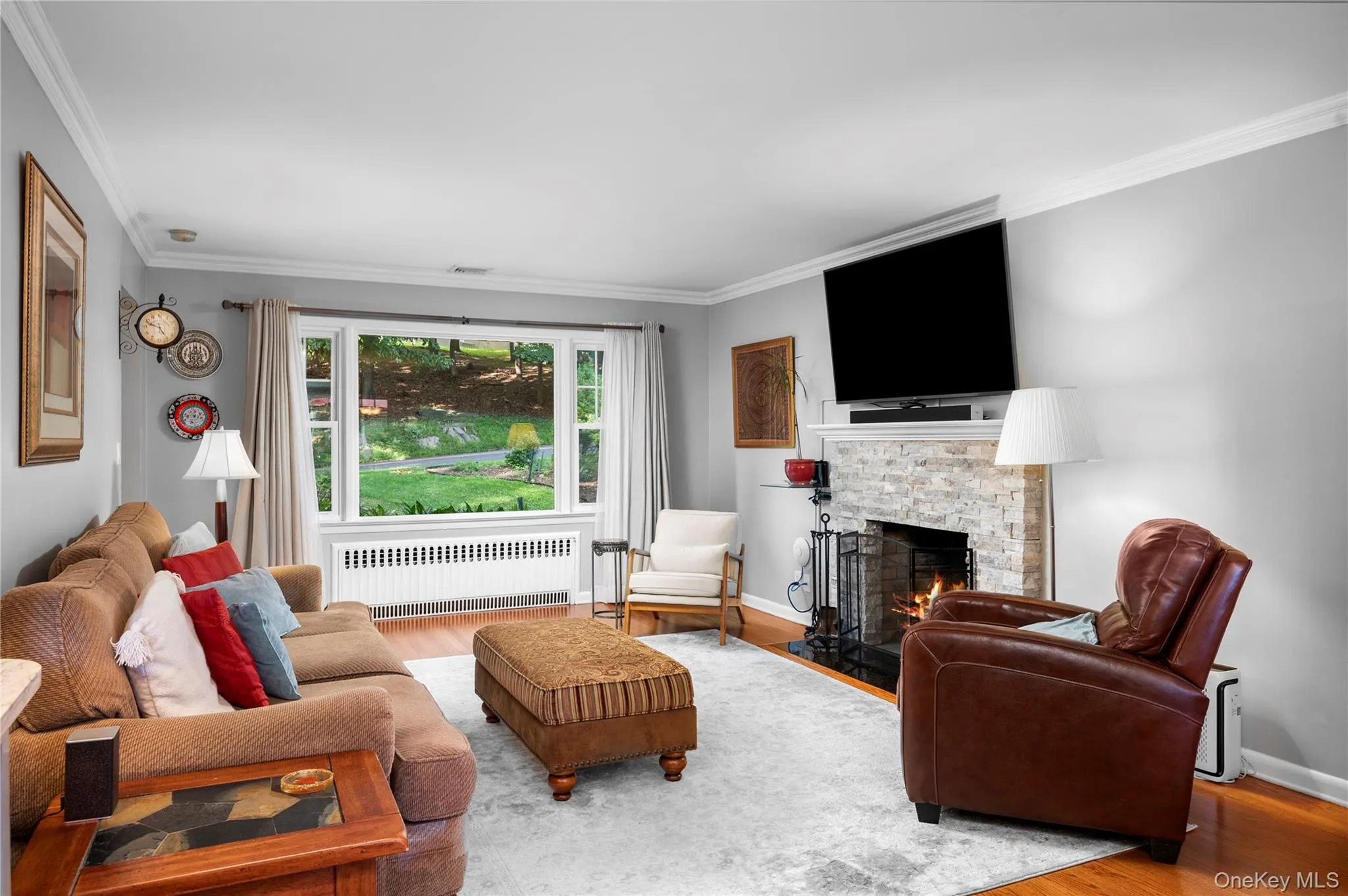 The fireplace adds warmth, charm, and character to this inviting home The fireplace adds warmth, charm, and character to this inviting home