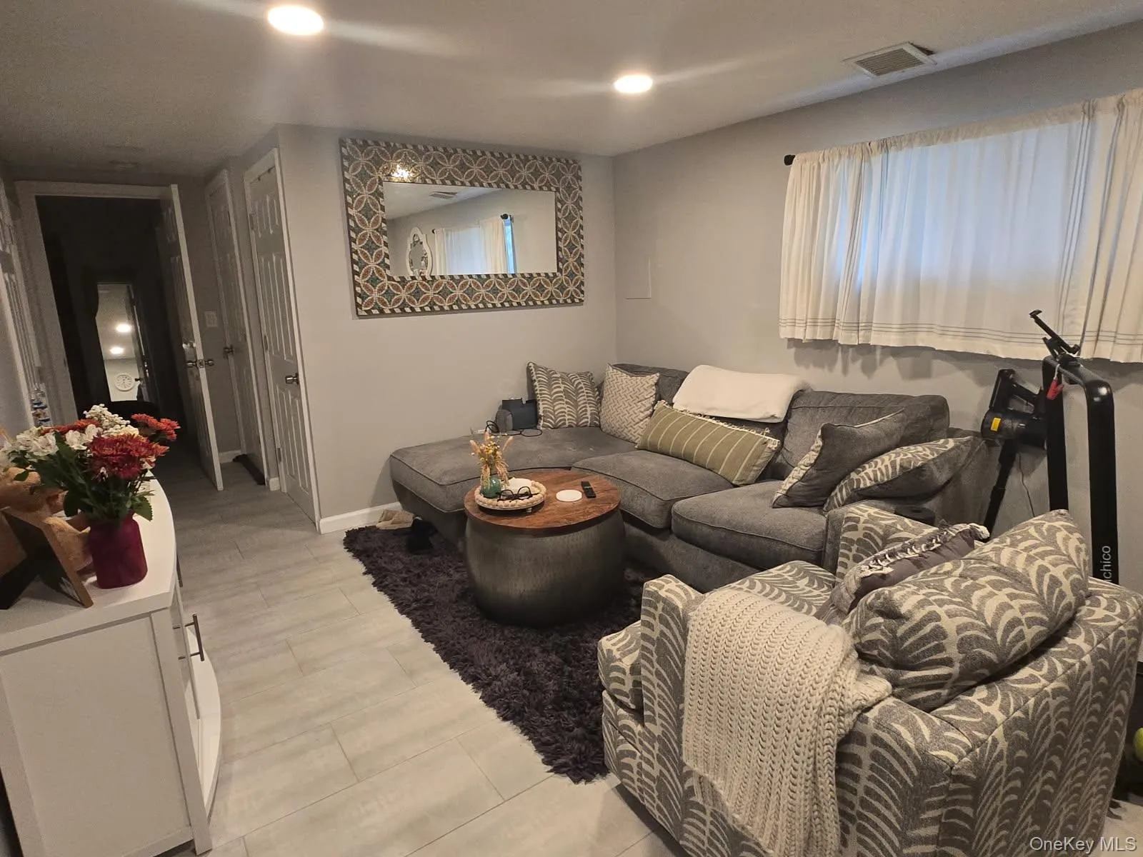 Living area featuring recessed lighting and baseboards Living area featuring recessed lighting and baseboards