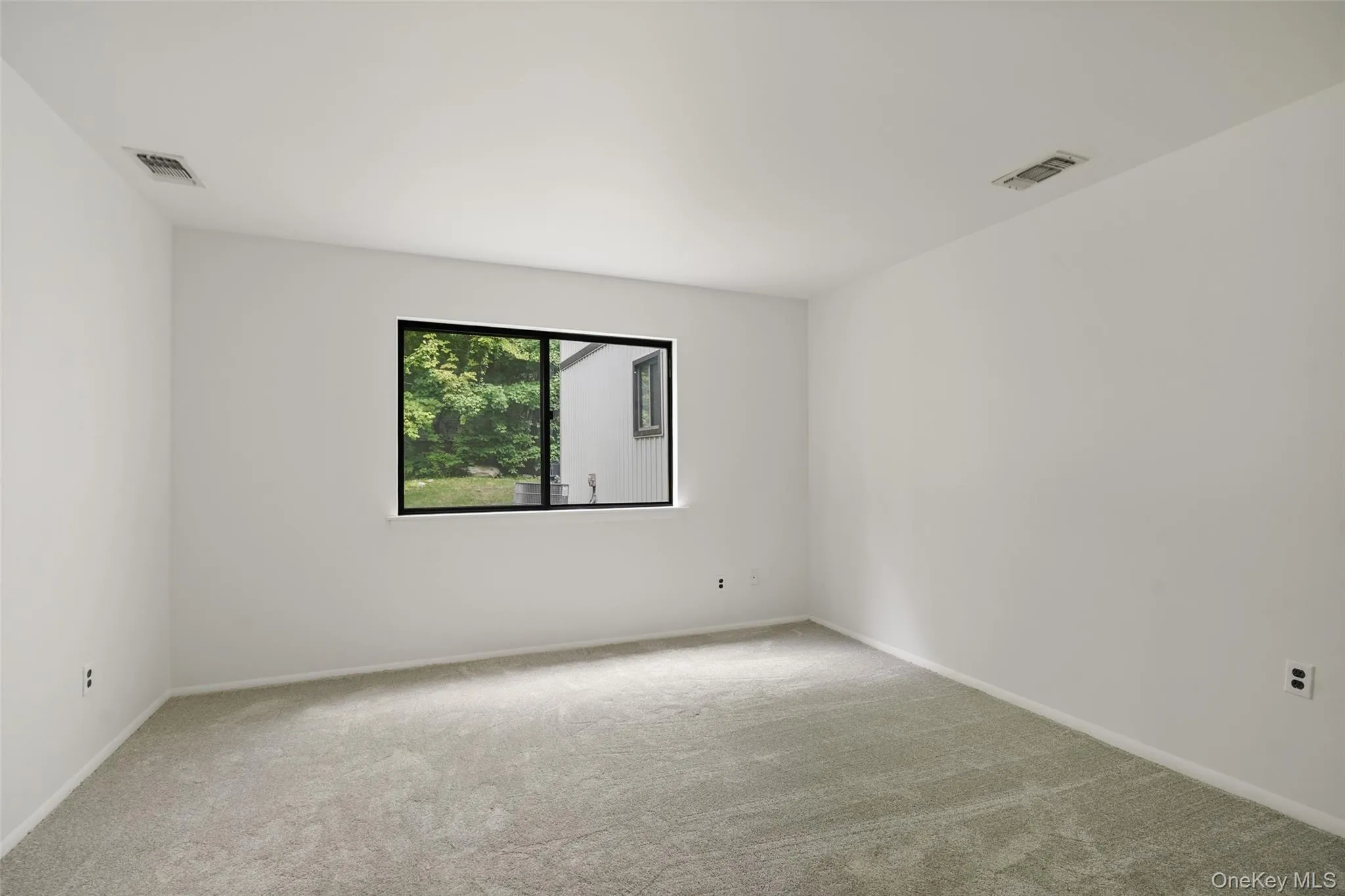 Bedroom with brand new carpeting Bedroom with brand new carpeting