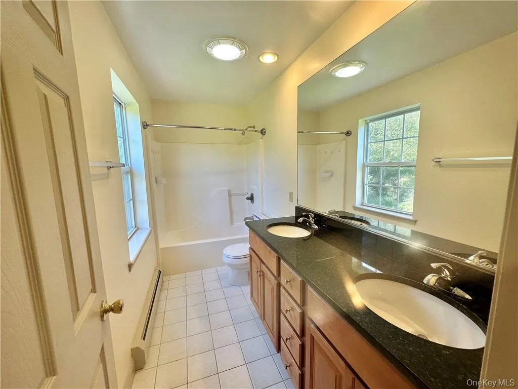 Large, updated full bath. Large, updated full bath.