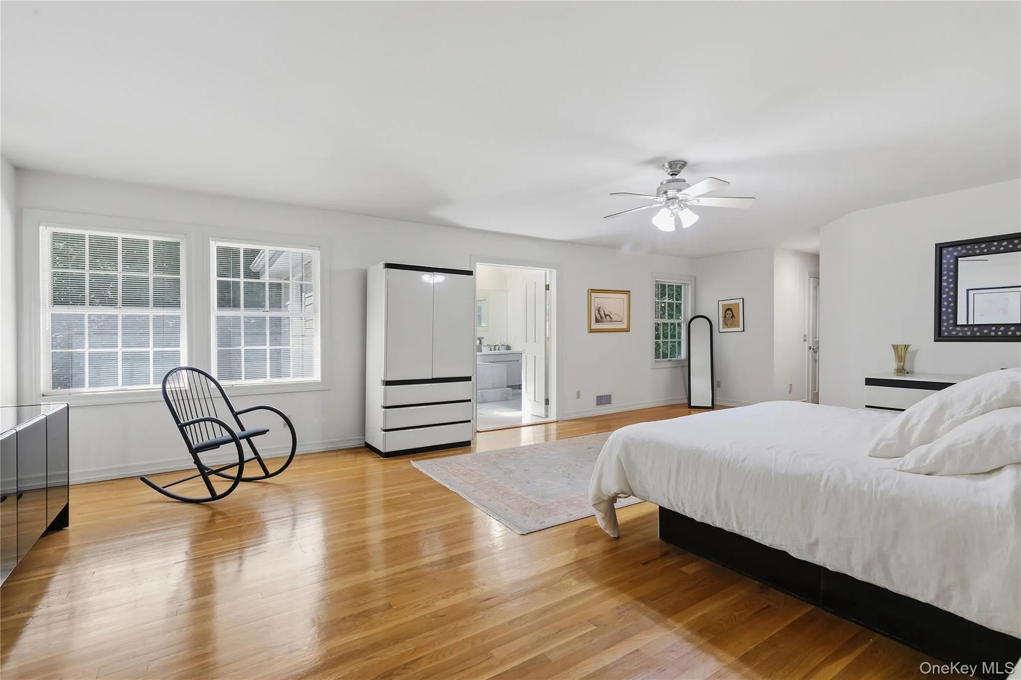 Primary bedroom features oversized windows, private bath, and his and hers walk-in closets. Primary bedroom features oversized windows, private bath, and his and hers walk-in closets.
