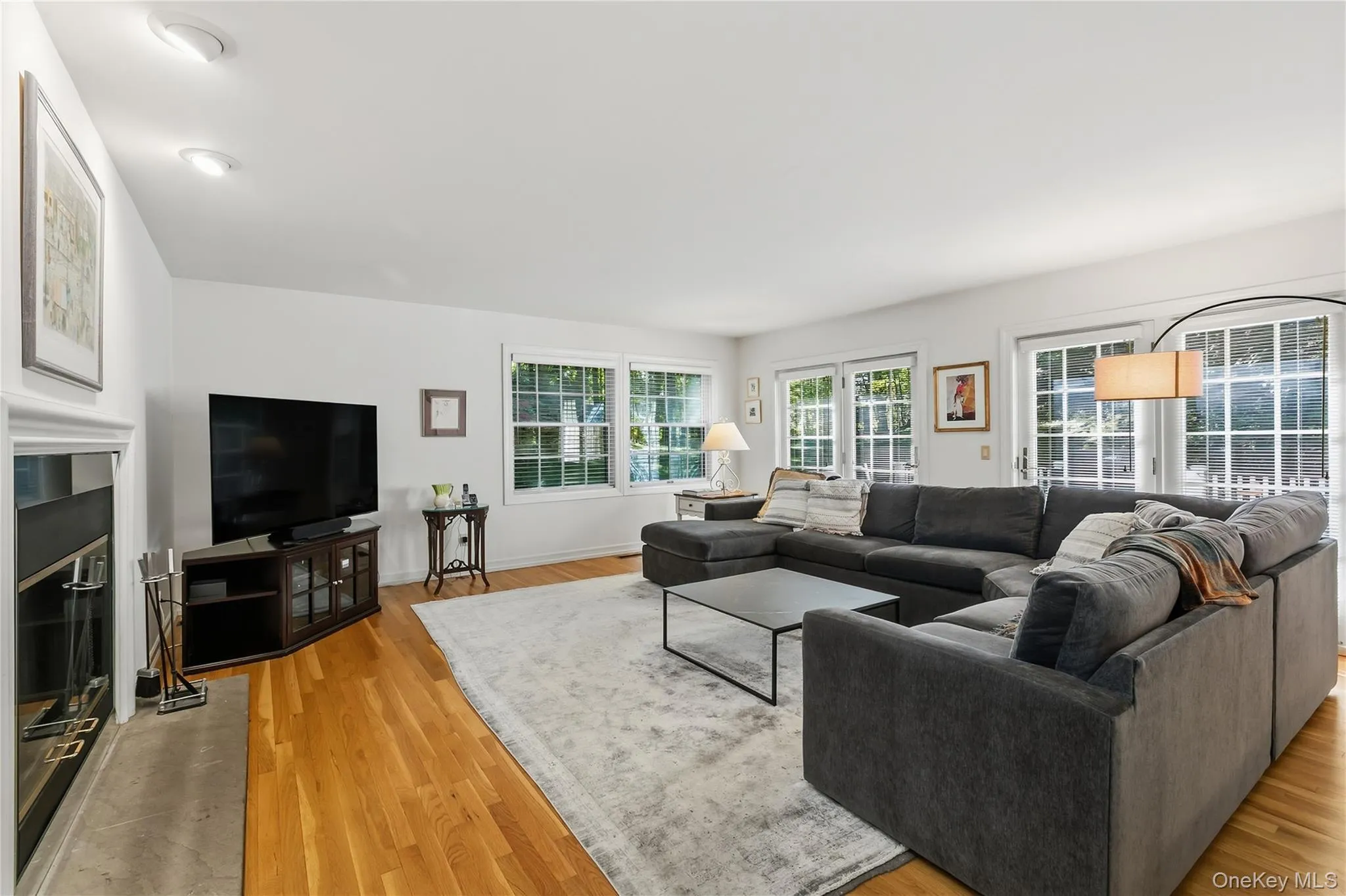 Family room features multiple windows overlooking side and back yard, double-sided masonry fireplace, doors out to back deck. Family room features multiple windows overlooking side and back yard, double-sided masonry fireplace, doors out to back deck.