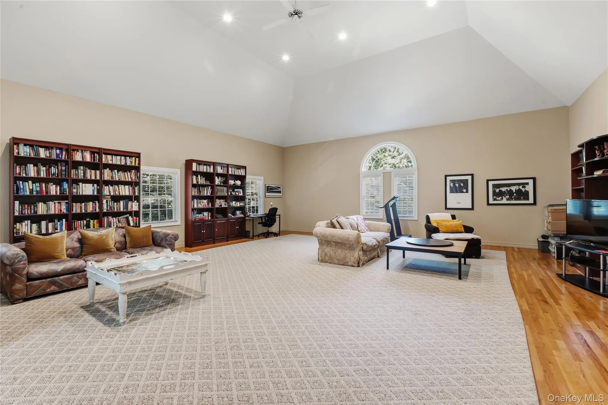 The Bonus room is approx. 29x35 and features a high tray ceiling with recessed lighting and a ceiling fan, hardwood floor, front and side view of property. The Bonus room is approx. 29x35 and features a high tray ceiling with recessed lighting and a ceiling fan, hardwood floor, front and side view of property.