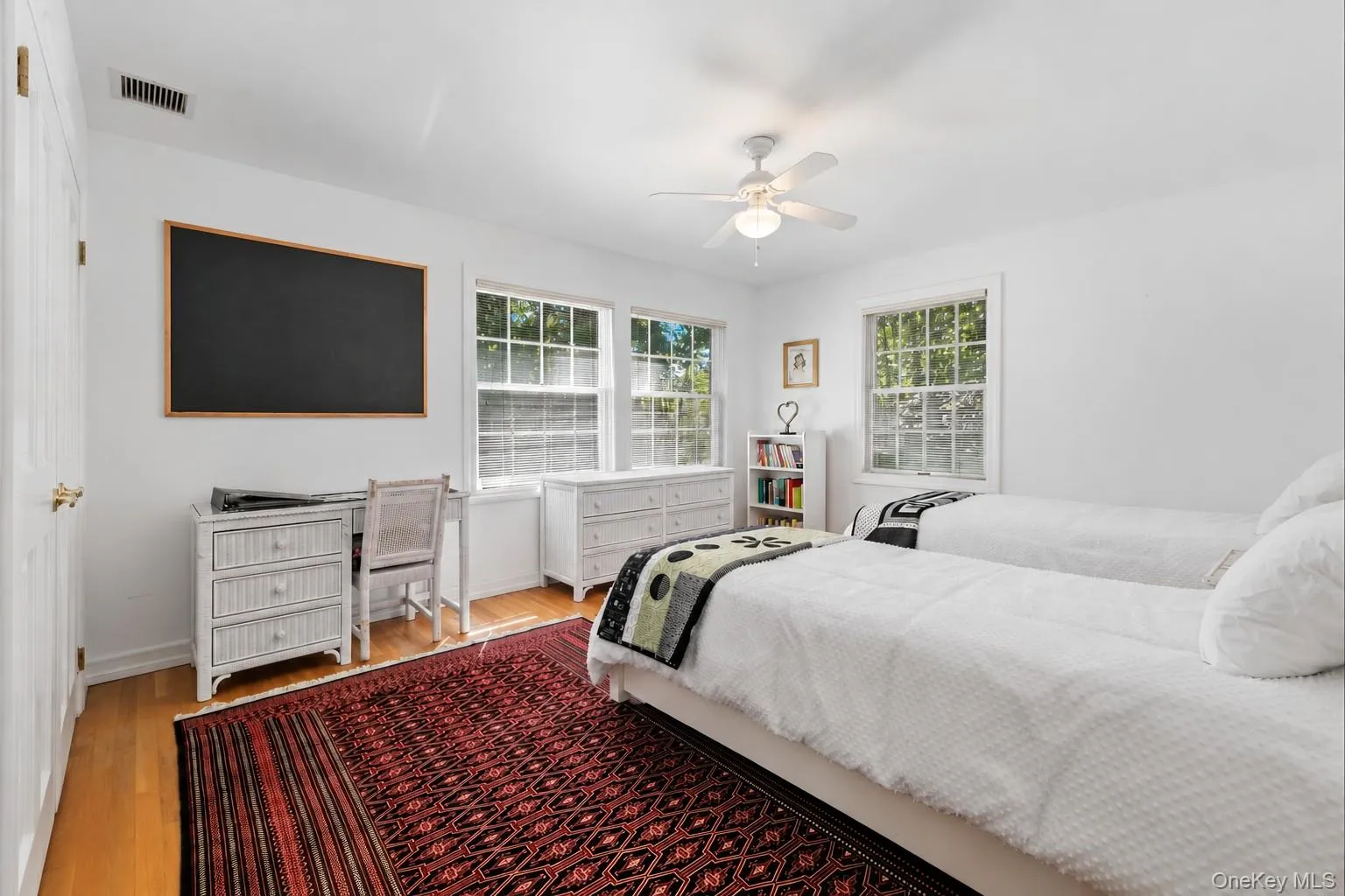 Family bedroom offers a double closet, ceiling fan and hardwood floors. Family bedroom offers a double closet, ceiling fan and hardwood floors.