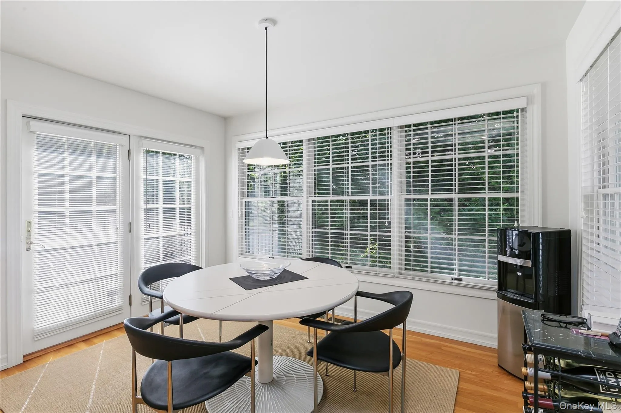 Spacious dining area offers large windows overlooking backyard, and doors out to deck. Spacious dining area offers large windows overlooking backyard, and doors out to deck.