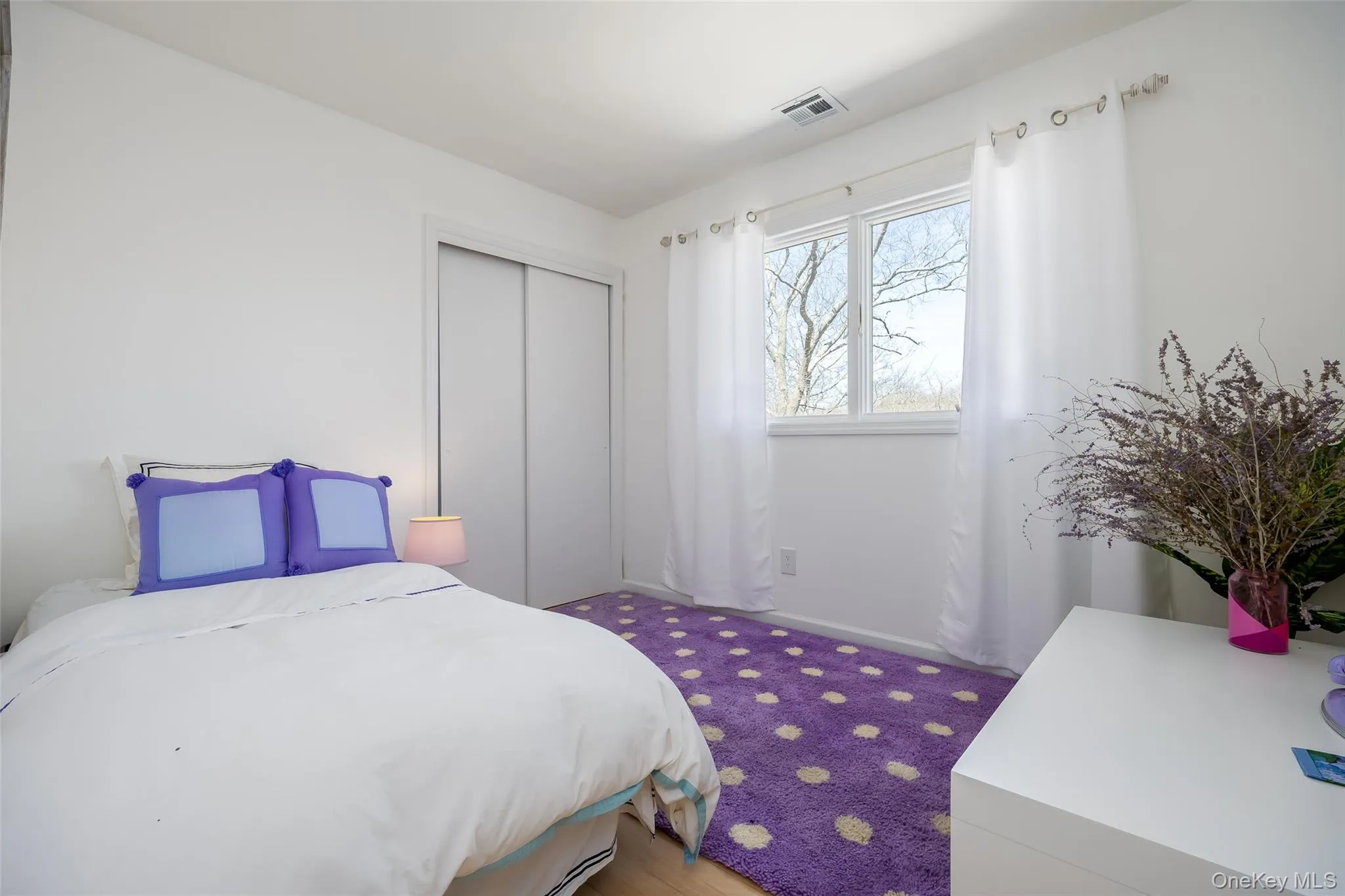 Bedroom featuring a closet and carpet Bedroom featuring a closet and carpet