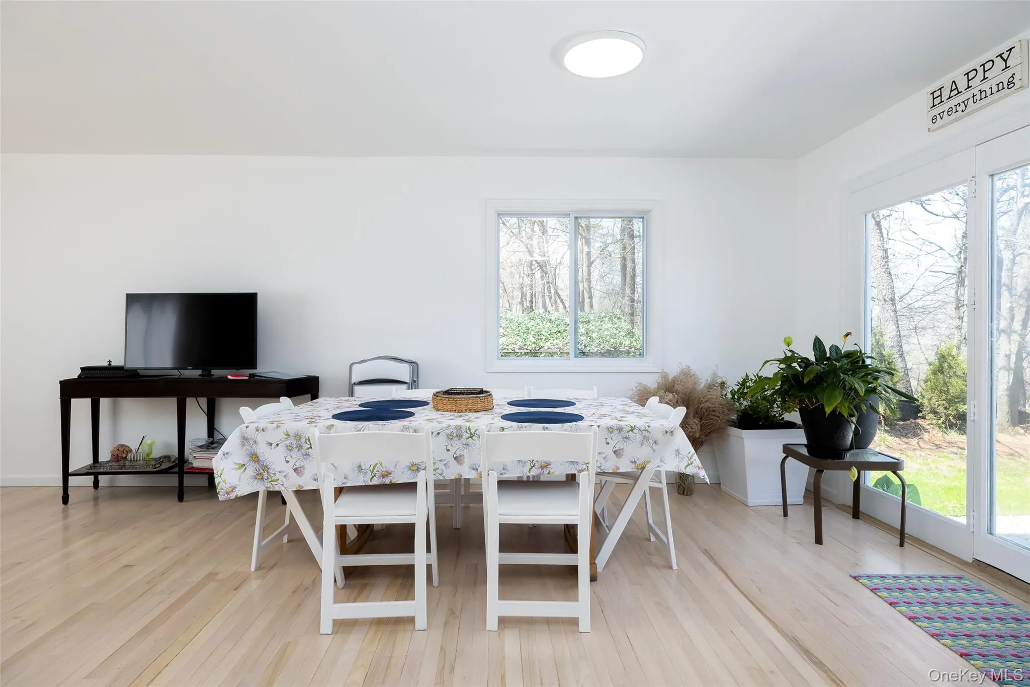 Dining space with healthy amount of natural light and light wood-style floors Dining space with healthy amount of natural light and light wood-style floors