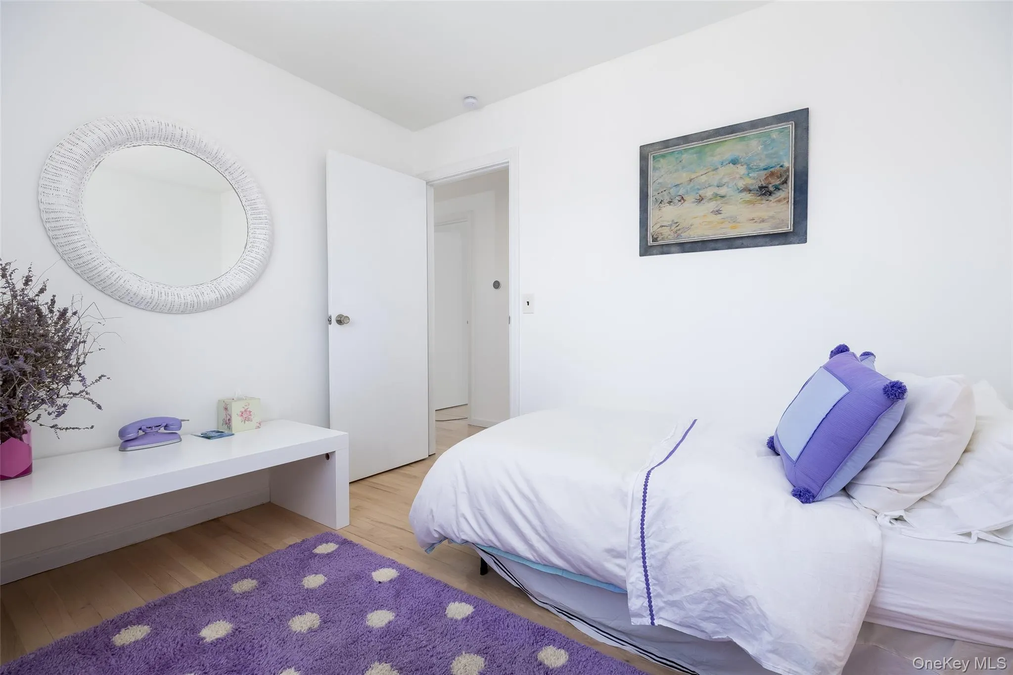 Bedroom featuring light wood finished floors Bedroom featuring light wood finished floors