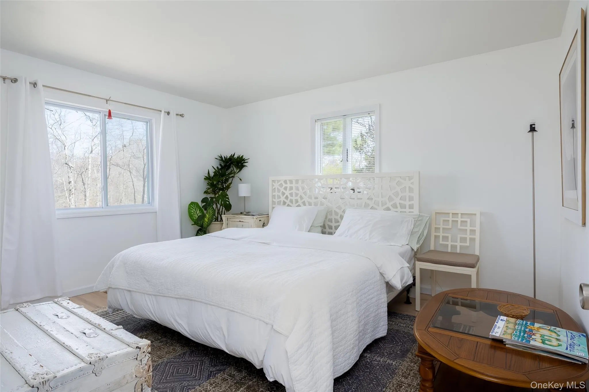 Bedroom featuring wood finished floors Bedroom featuring wood finished floors