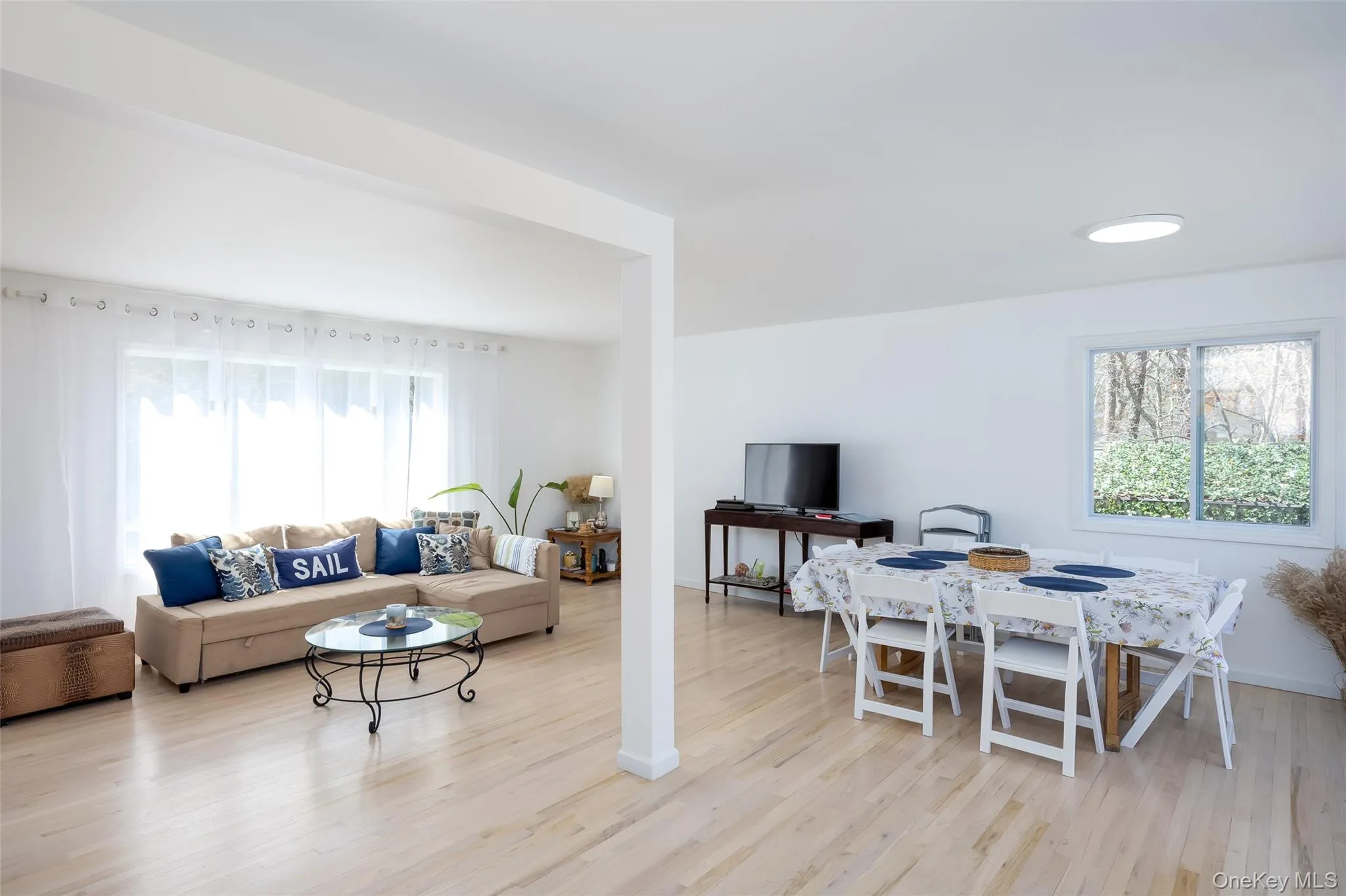 Living area featuring wood finished floors and baseboards Living area featuring wood finished floors and baseboards