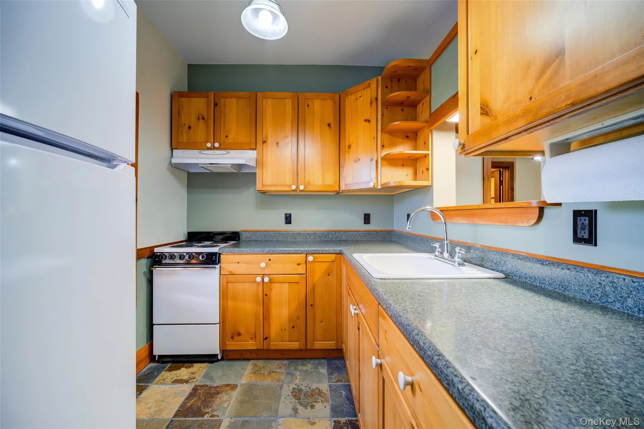 Kitchen with sink and white appliances Kitchen with sink and white appliances