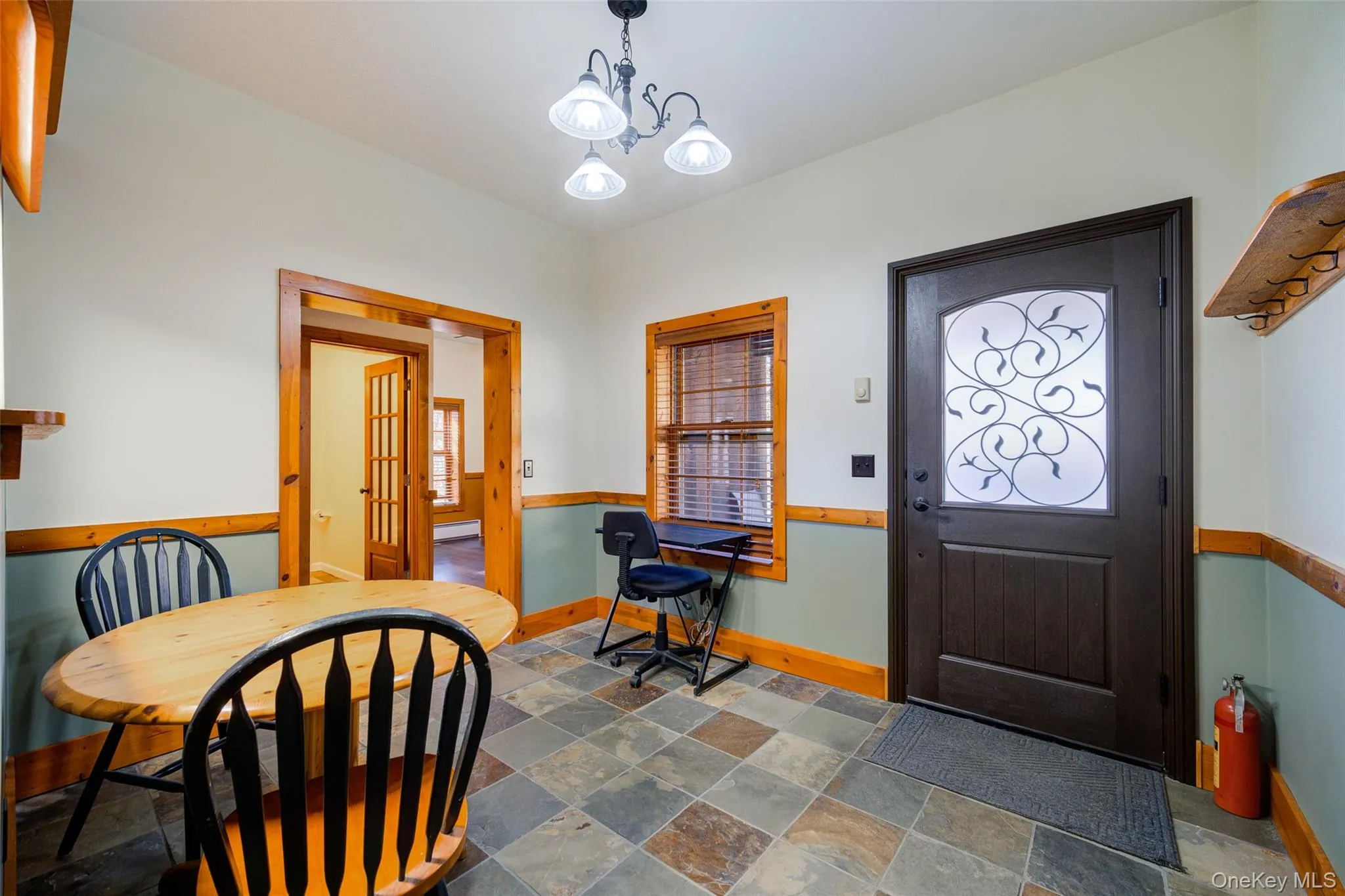 Entrance foyer featuring a chandelier Entrance foyer featuring a chandelier