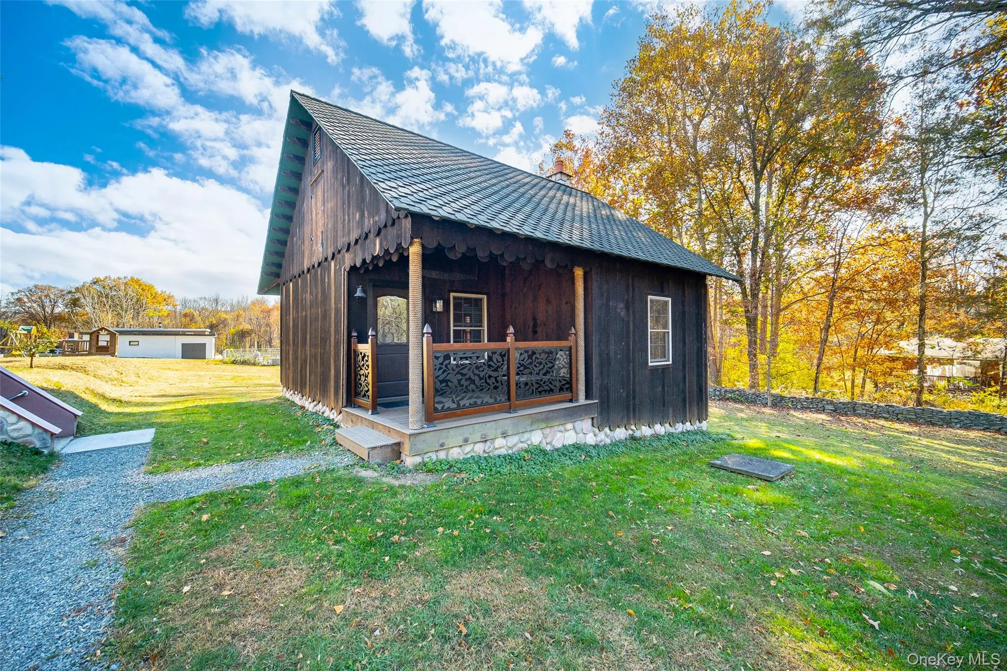 View of outdoor structure featuring a lawn View of outdoor structure featuring a lawn
