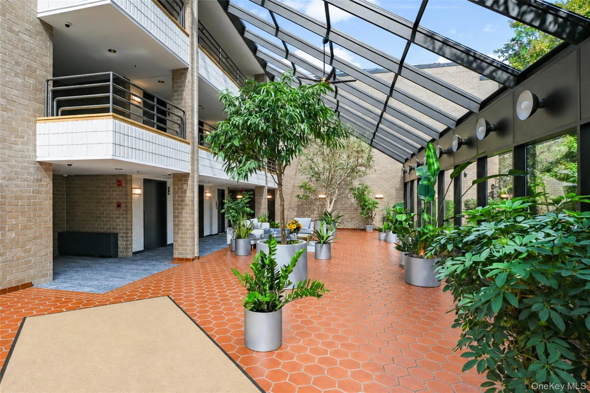 Drenched in sunlight, the lobby welcomes the outside in. Drenched in sunlight, the lobby welcomes the outside in.