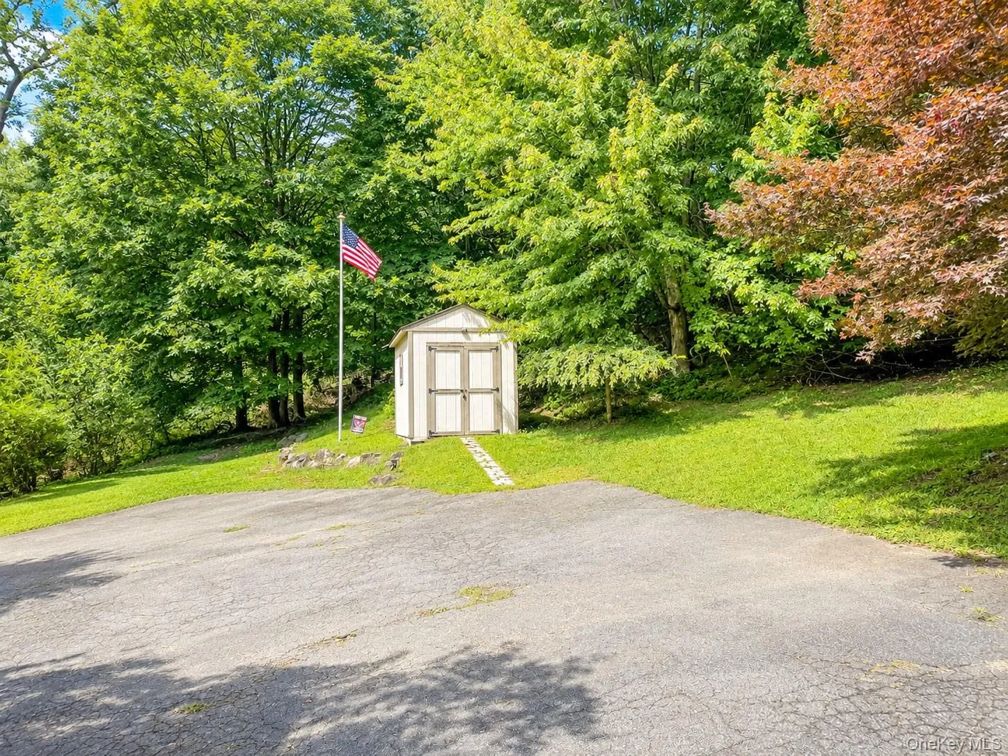 Storage Shed & Expansive Parking Area – Photo Virtually Enhanced Storage Shed & Expansive Parking Area – Photo Virtually Enhanced