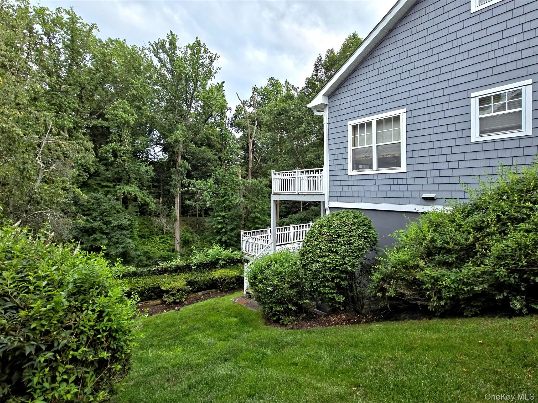View of the side of the home, with the nature trail in the back yard View of the side of the home, with the nature trail in the back yard