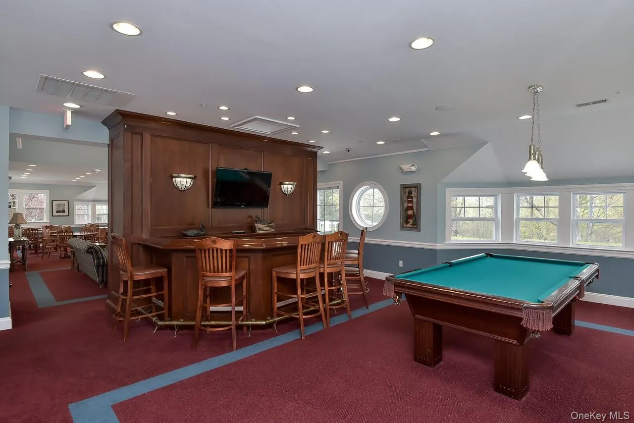 The Club House is furnished with a bar area and pool table The Club House is furnished with a bar area and pool table