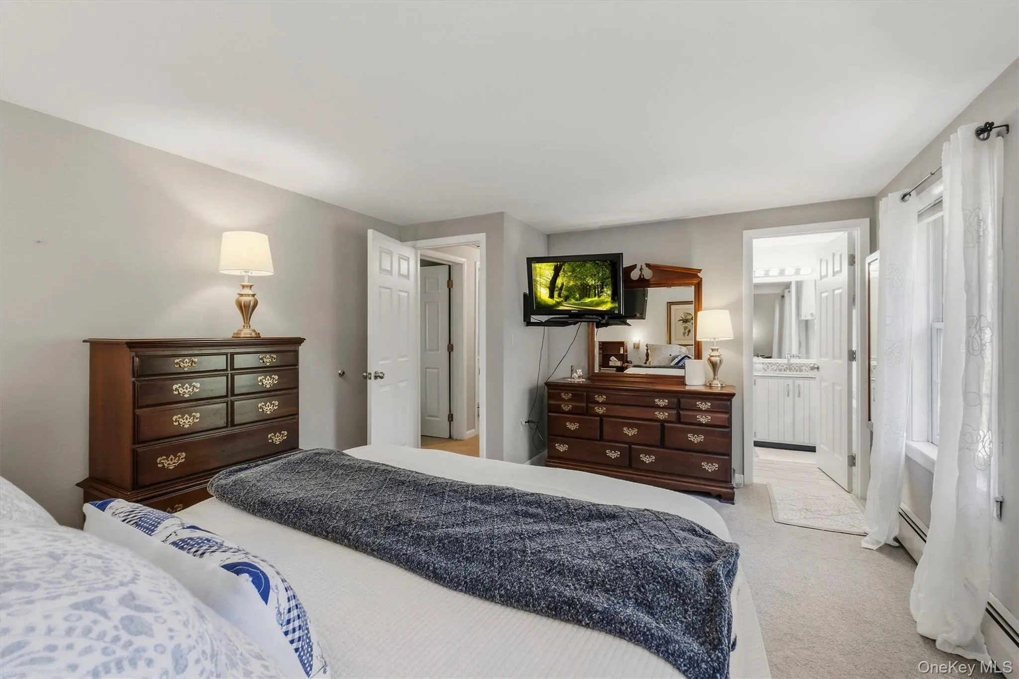 Primary bedroom with wall to wall carpet. Primary bedroom with wall to wall carpet.