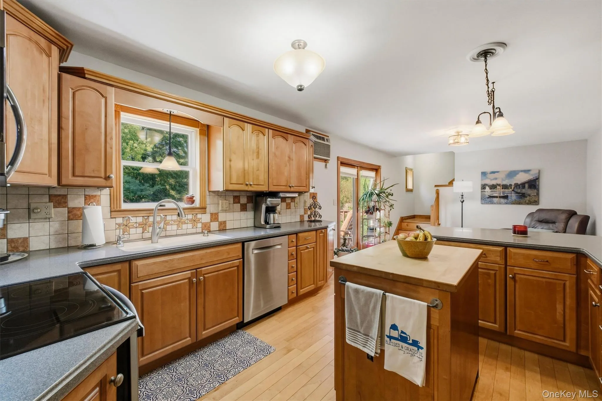 Hardwood Floor and wood cabinets. Center island. Hardwood Floor and wood cabinets. Center island.