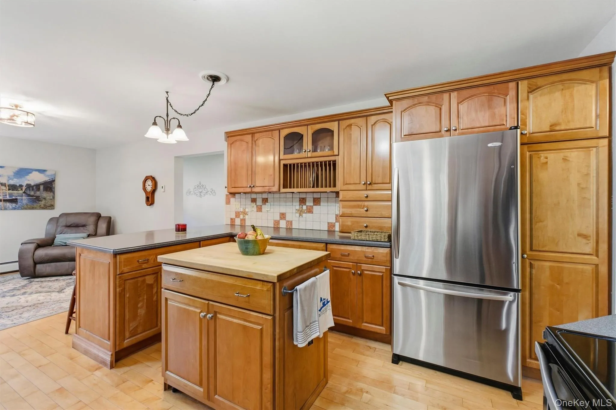 Hardwood floors. Stainless appliances, island with seating. Hardwood floors. Stainless appliances, island with seating.