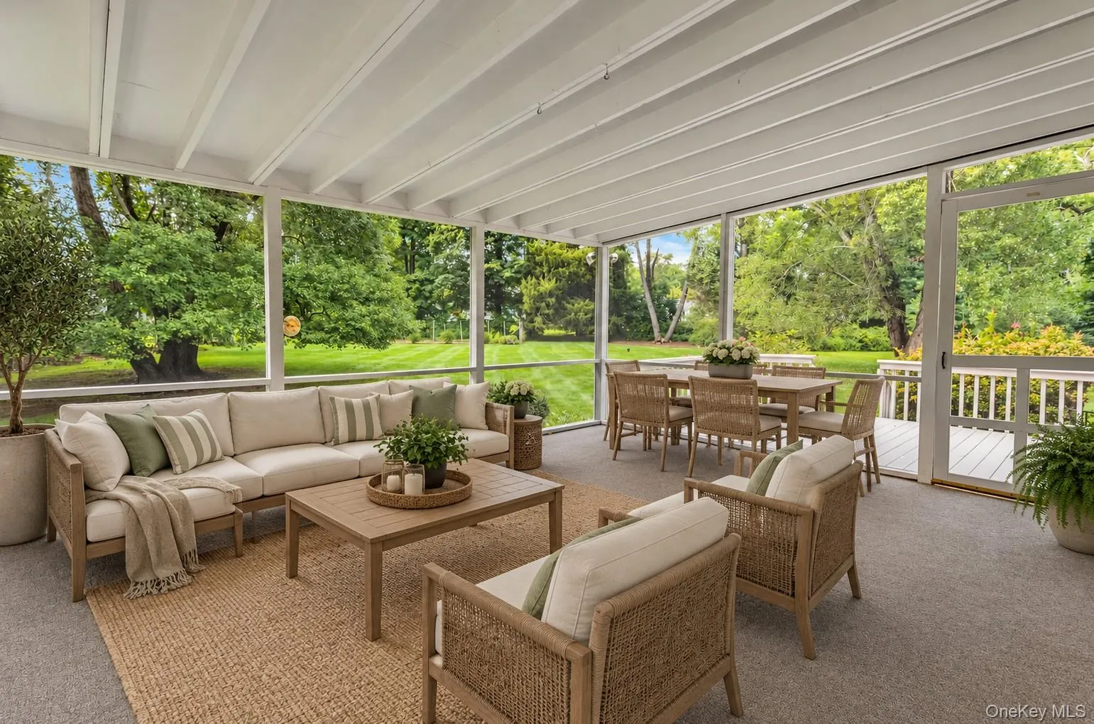 Screened porch (virtually staged) off of Kitchen. Screened porch (virtually staged) off of Kitchen.