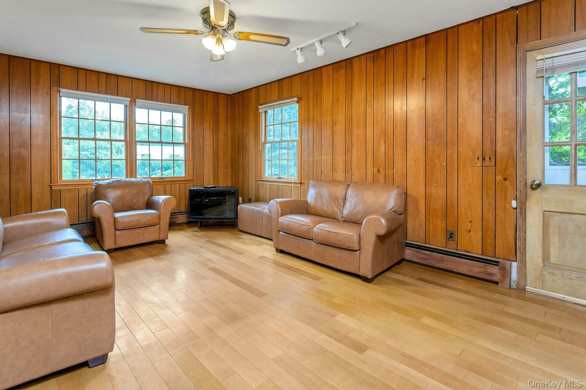 Family Room with door out to driveway. Family Room with door out to driveway.
