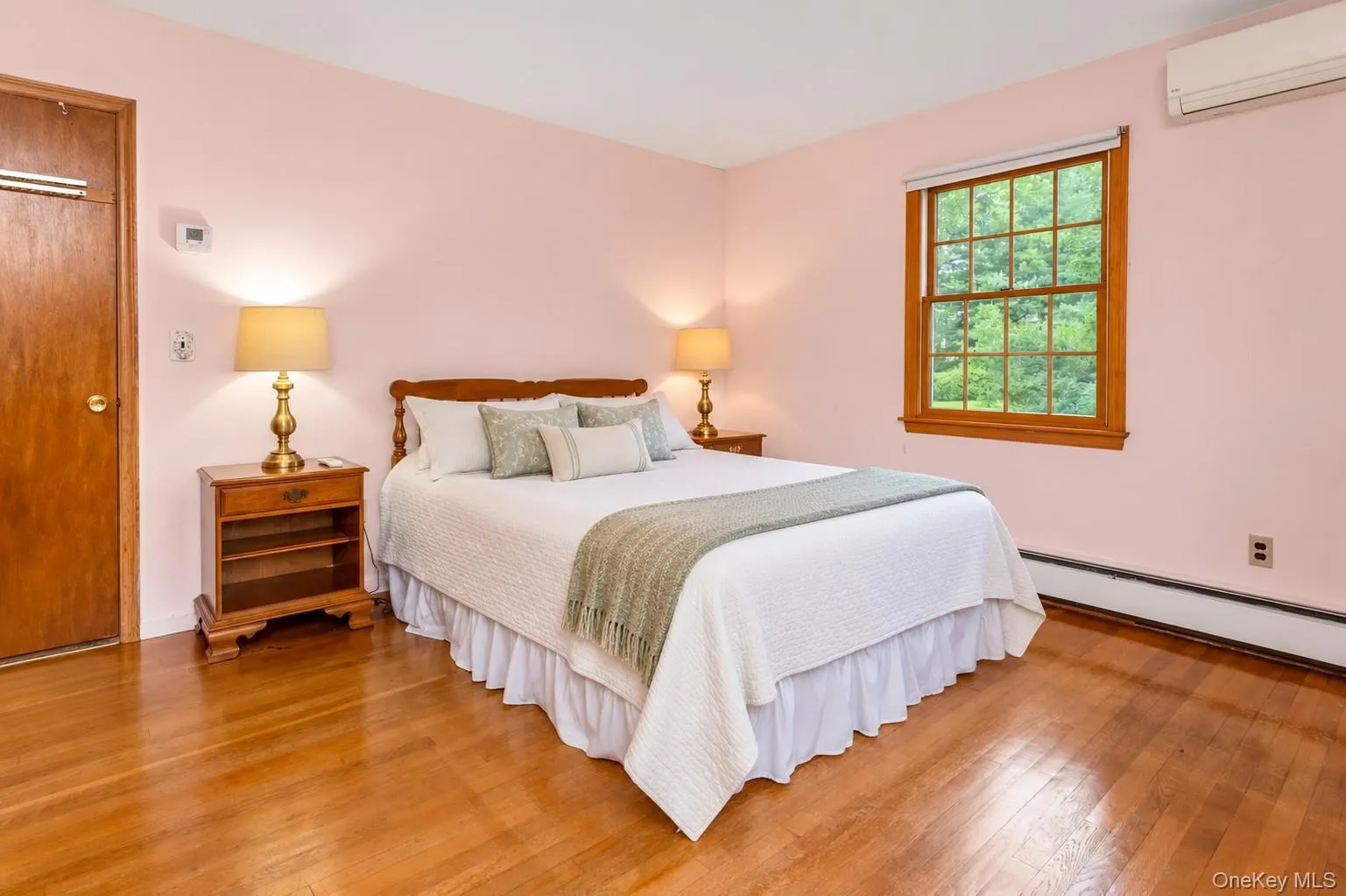 Primary Bedroom (virtually staged) on main floor. Primary Bedroom (virtually staged) on main floor.