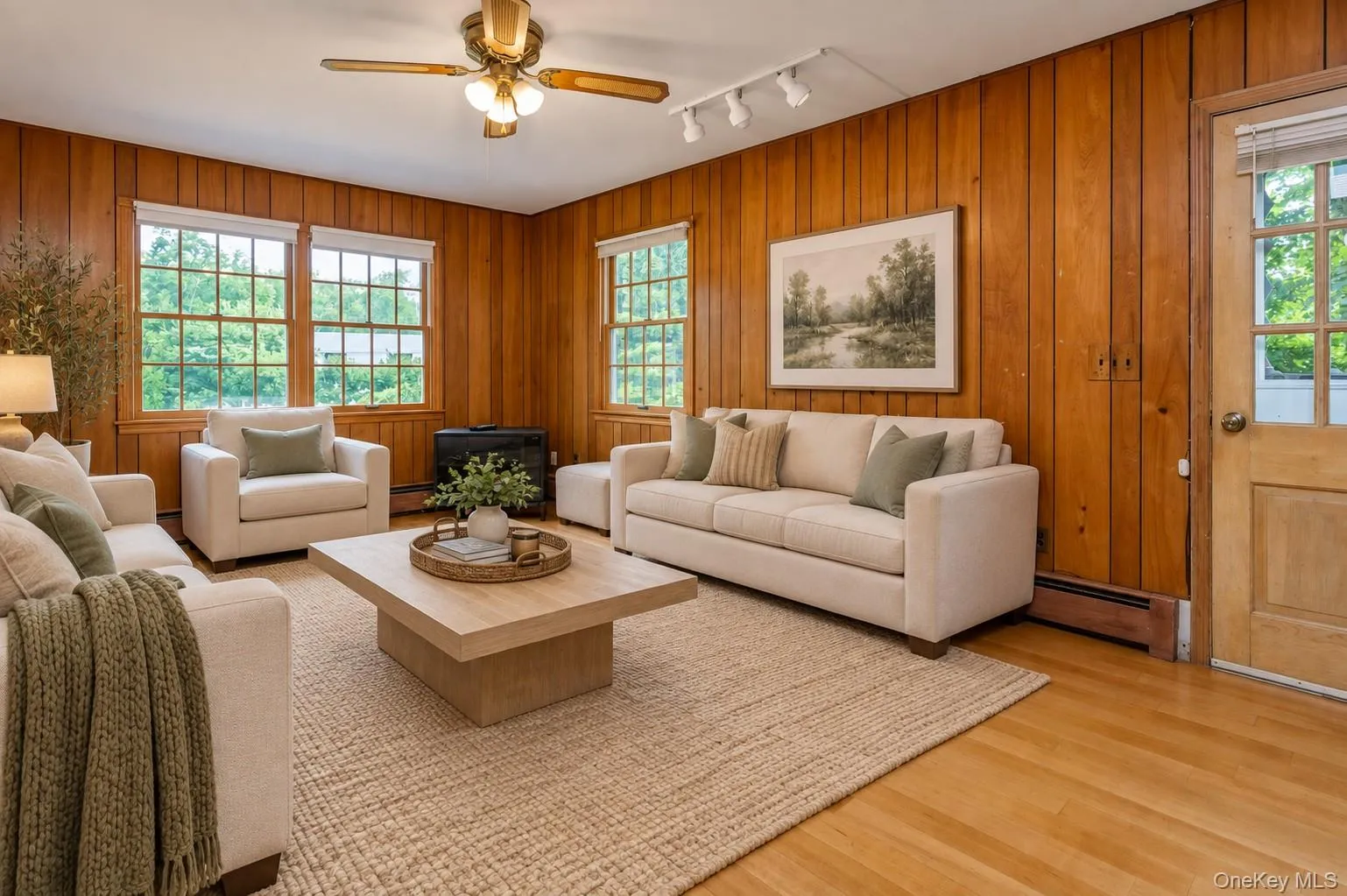 Family Room virtually staged with door out to driveway. Family Room virtually staged with door out to driveway.